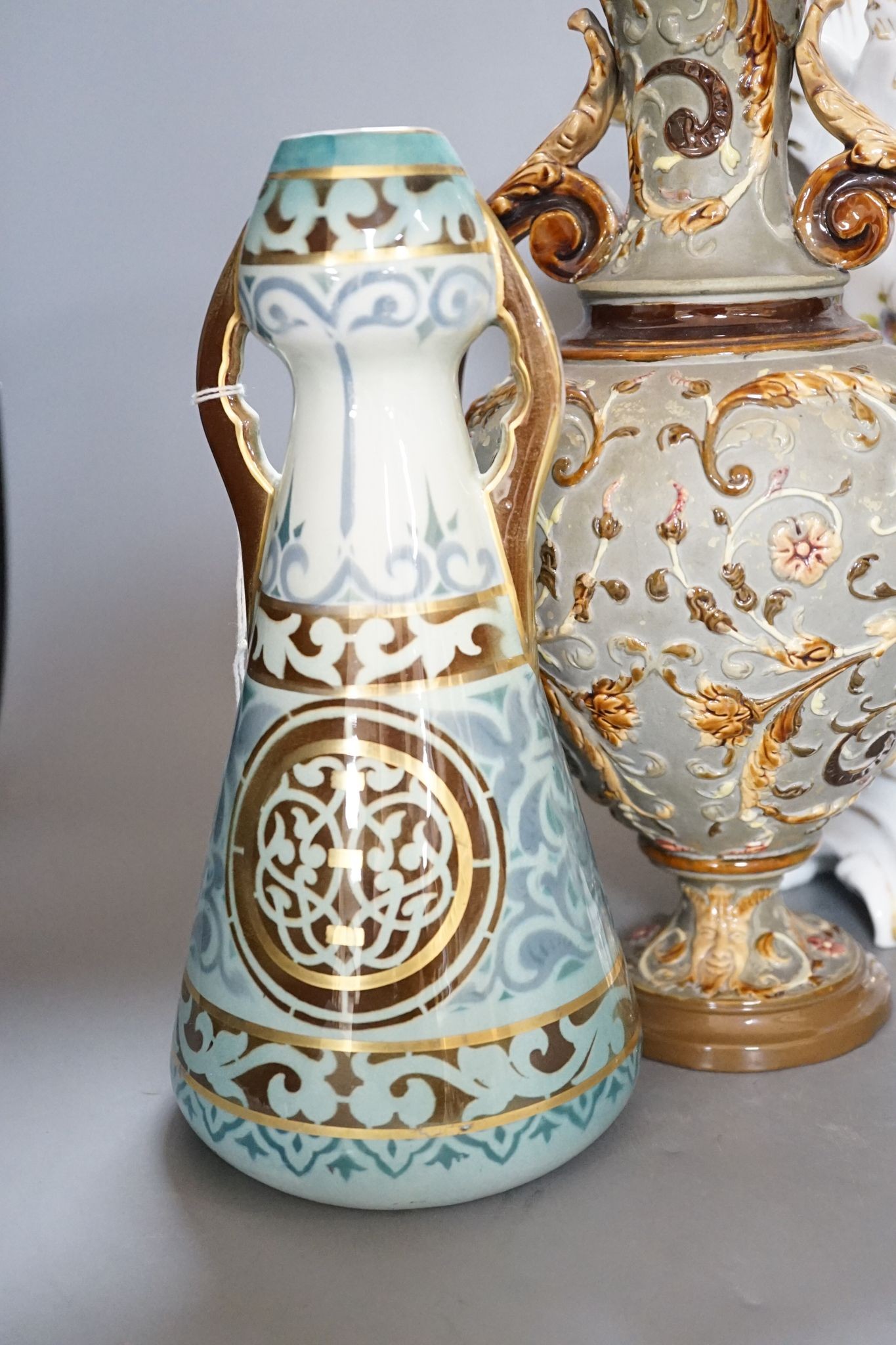 Four pairs of continental porcelain vases including a pair of Wilhelm Schiller & Sons vases